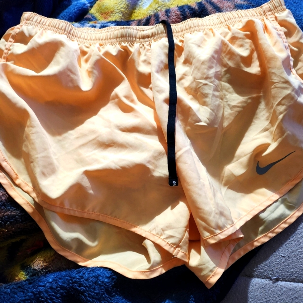 A yellow Nike dri-fit large shorts